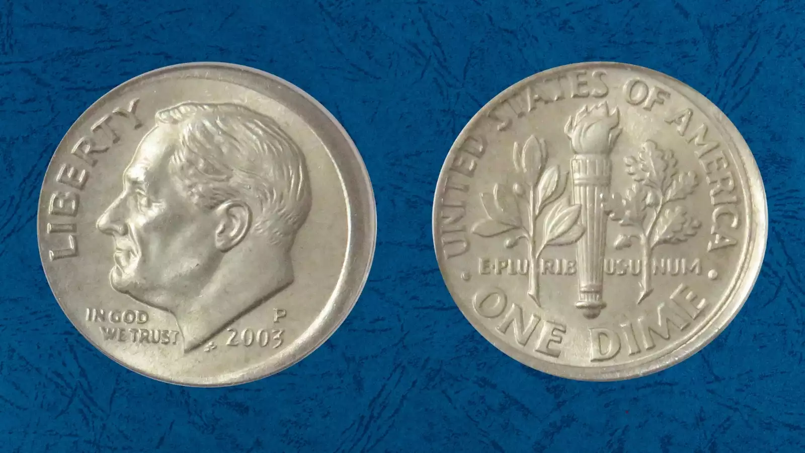 2003-D dime capped die error showing weak brockage design on obverse face