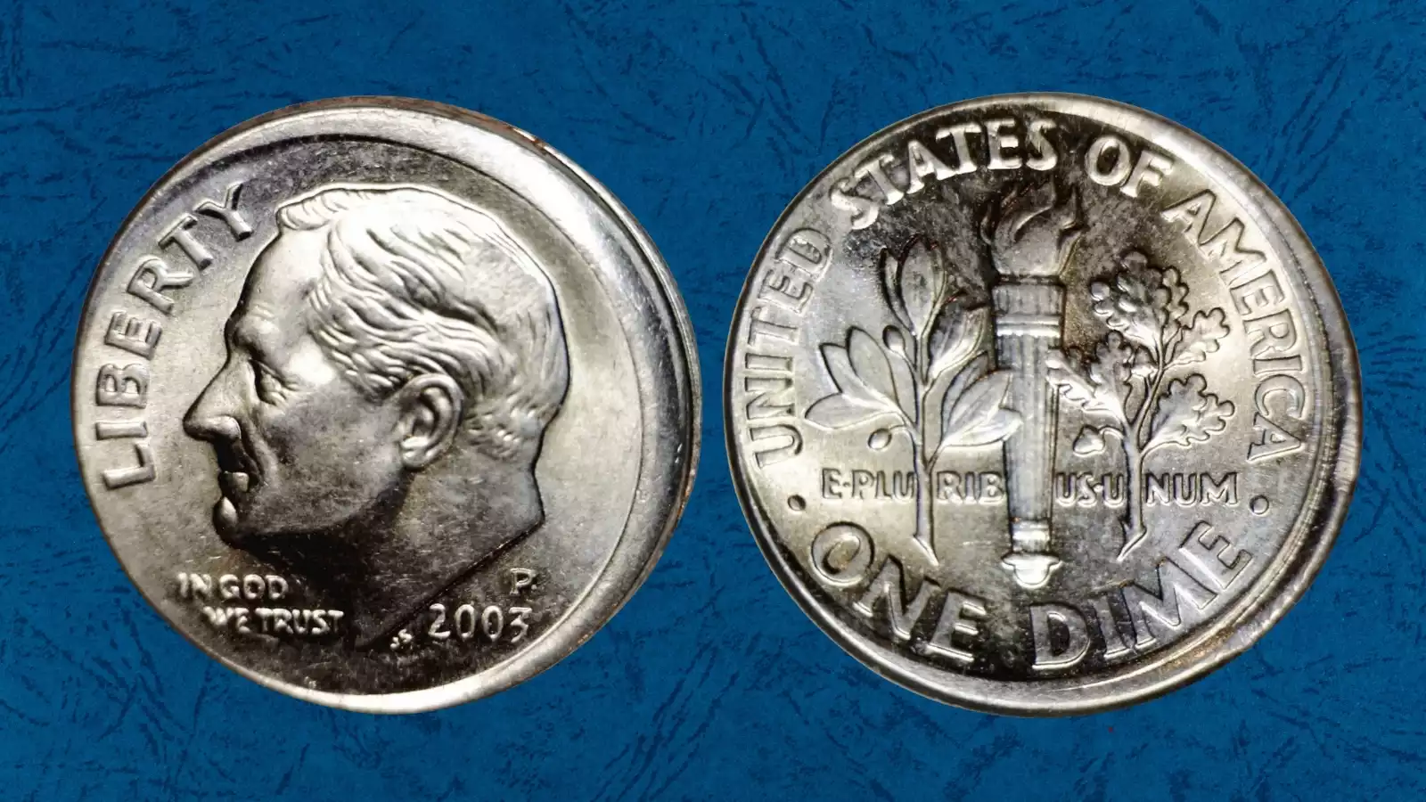 2003-P dime off-center strike error showing blank crescent area with design shifted to one side