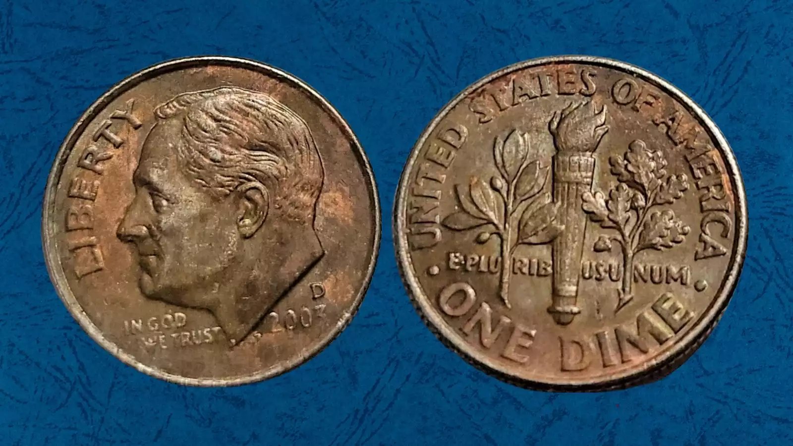 2003-D dime missing clad layer error showing exposed copper core on reverse side
